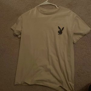 a brand new playboi cream colored shirt